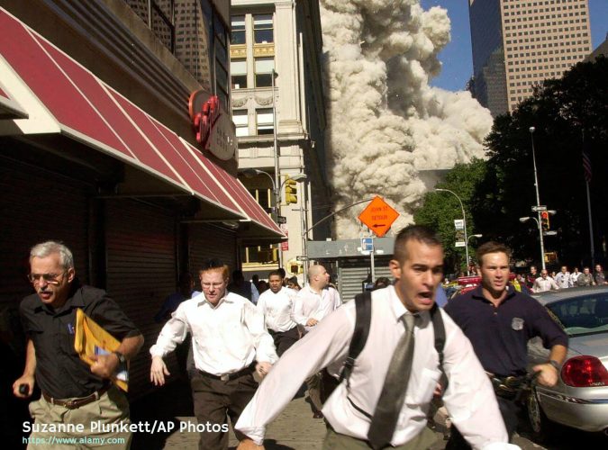 2MGH5EA FILE - In this Tuesday, Sept. 11, 2001 file phtoo, people run away from a collapsing World Trade Center tower in New York. Al-Qaida's 9/11 attacks against the U.S. killed almost 3,000 people. (AP Photo/Suzanne Plunkett)